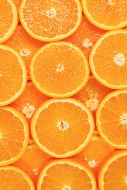 Fatias de laranjas como pano de fundo, vista superior.