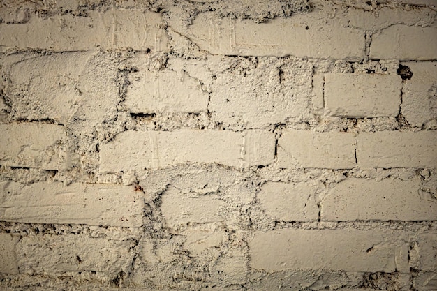 Fechar a textura da parede de tijolos pintados
