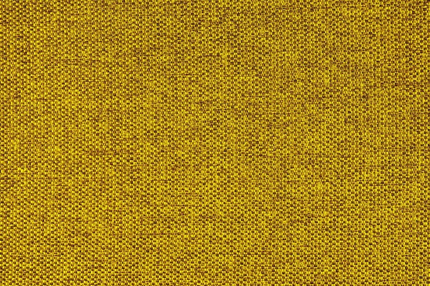 Fechar a textura do tecido de estofamento de tecido grosso amarelo Fundo têxtil decorativo