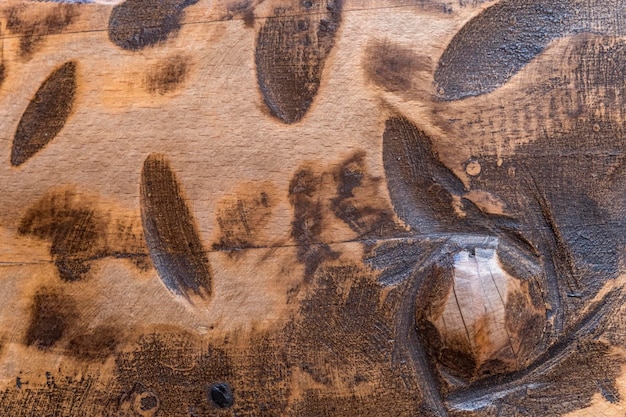 Fechar a velha textura rústica marrom das tábuas de madeira escura Fundo de madeira com textura áspera Madeira serrada