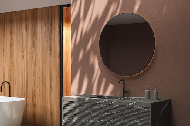 Feche a bacia de mármore com espelho oval pendurado na parede marrom, armário de mármore moderno.