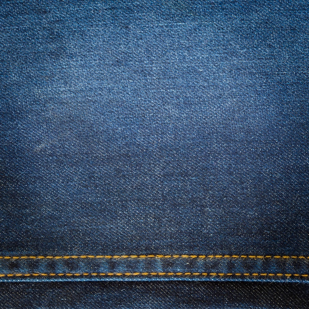 Foto feche acima fundo e textura de jeans com espaço