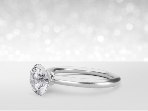 Feche o anel de diamante elegante no conceito de fundo branco brilhante bokeh para escolher o melhor design de gema de diamante 3d render