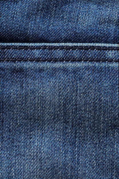 Feche o fundo da textura do jeans azul com espaço em branco