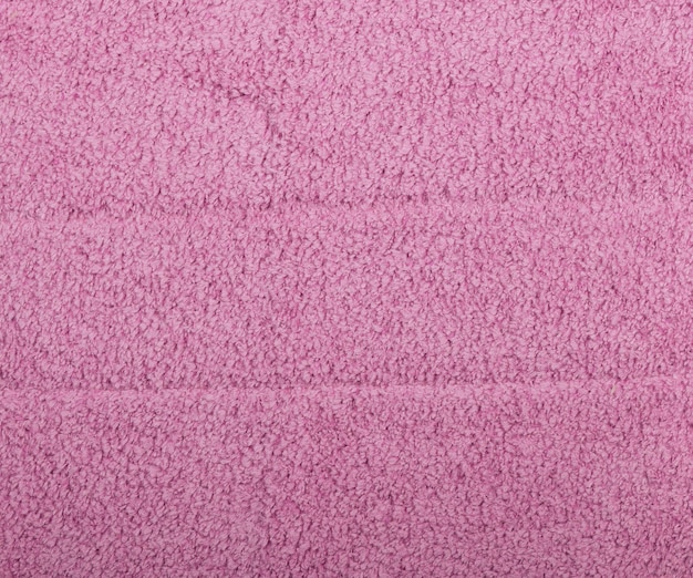 Feche o pano de limpeza doméstico de microfibra rosa ou a textura de fundo da toalha