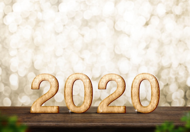 Feliz ano novo 2020 na mesa de madeira marrom no bokeh de ouro brilho