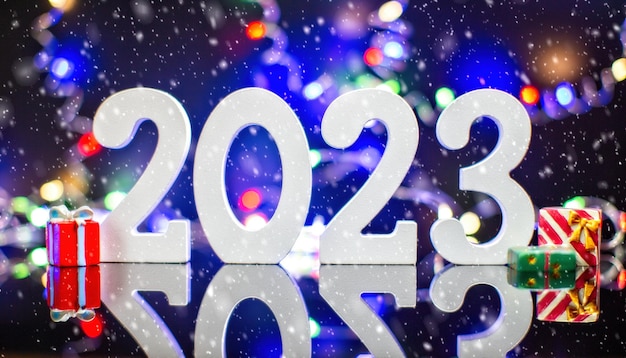 Feliz año nuevo 2023 fondo tarjeta de vacaciones de año nuevo con luces brillantes