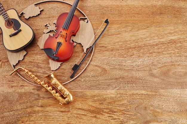 Feliz dia mundial da música instrumentos musicais com fundo globo