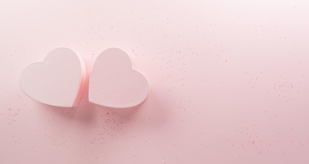 Feliz día de san valentín y decoración de amor concepto de fondo hecho de dos corazones sobre fondo rosa pastel