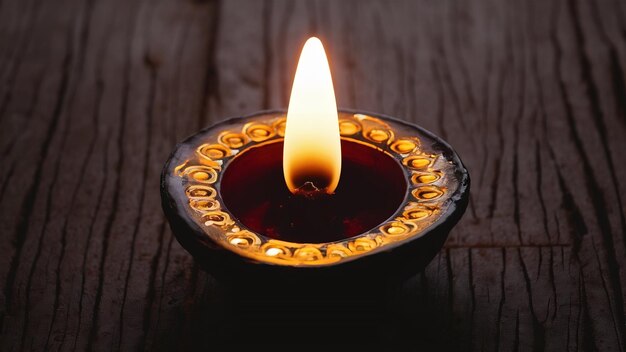 Foto feliz diwali ou feliz deepavali cartão de saudação feito usando uma fotografia de diya ou lâmpada de óleo