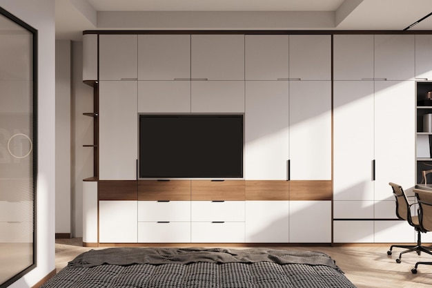 Fernsehschrank mit Fernseher an der weißen Wand im Schlafzimmer