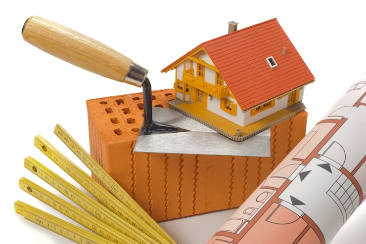 Foto ferramentas e tijolos como símbolo para a construção de casas
