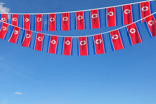 Festliche Ammer der Nordkorea-Flagge, die an einem blauen Himmel hängt, rendern