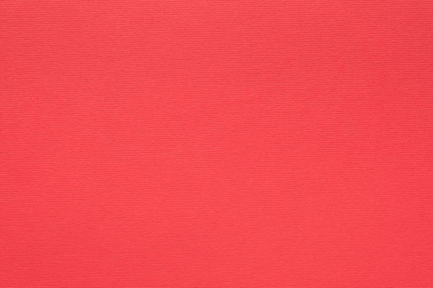 Fibras de cartón de color de fondo de textura de papel rojo y concepto de espacio vacío de grano
