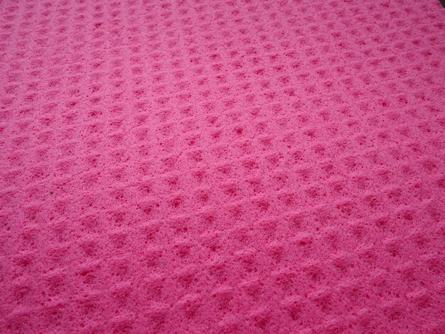 Fibras de esponja padrão de textura de esponja superfície fechada fundo magenta rosa