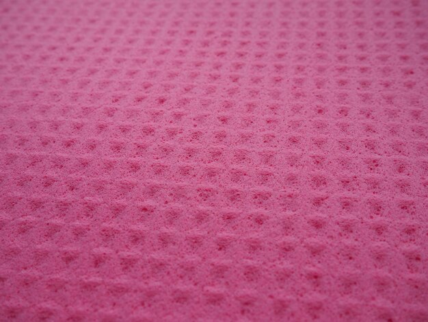 Fibras de esponja padrão de textura de esponja superfície fechada fundo magenta rosa