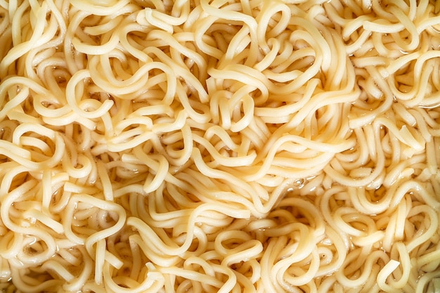 Fideos instantáneos macrofideos instantáneos de texturaAsiaComida asiáticaForma de bloqueTazónPlanta de cereal