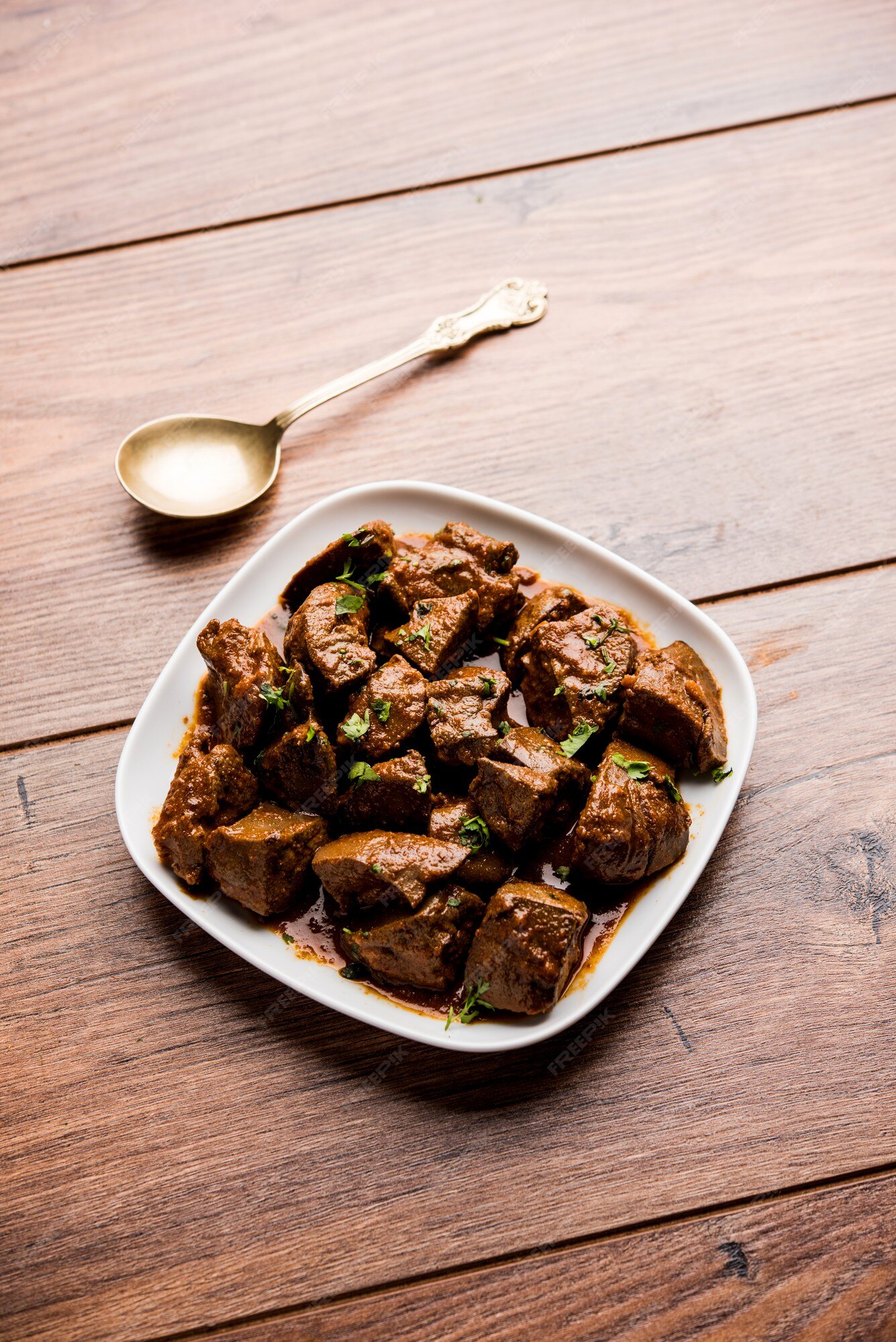 Fígado de carneiro frito ou kaleji masala, receita não vegetariana popular  da índia e do paquistão