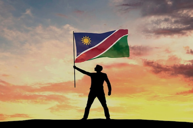 Figura de silueta masculina ondeando la bandera de Namibia 3D Rendering