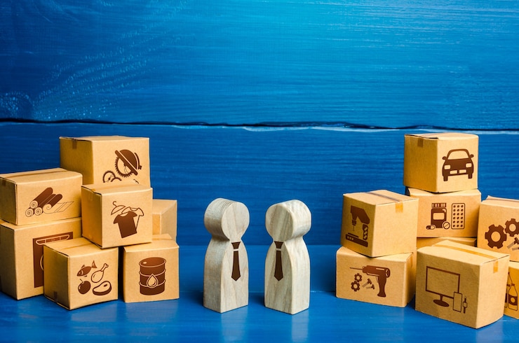 Foto figuras de personas que llevan a cabo negociaciones comerciales y cajas. servicios comerciales de bienes, procesos comerciales