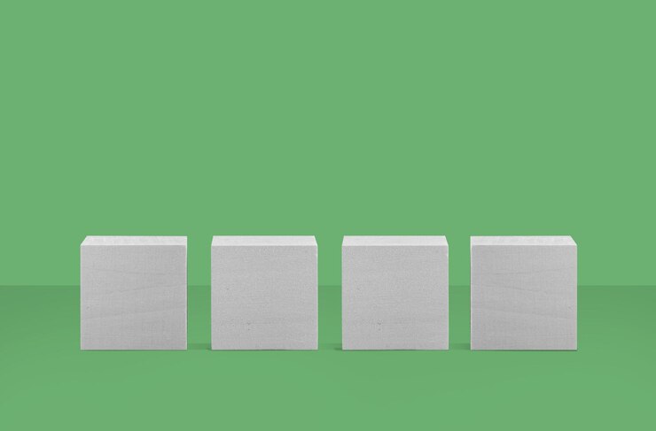 Foto una fila de cubos blancos en una fila en una colocación de productos de fondo verde