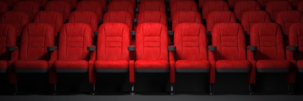 Filas de assentos vermelhos na sala de cinema vazia conceito de cinema e cinema
