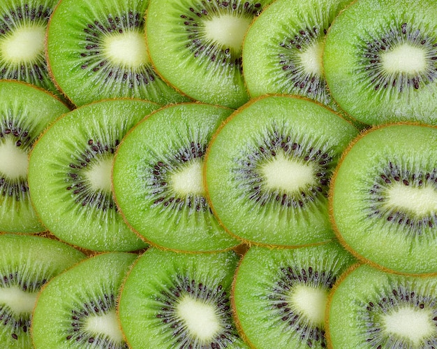 Foto filas de fondo de rodajas de kiwi