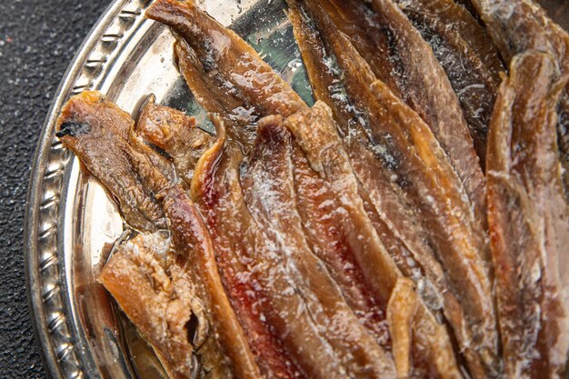 Filé de anchoa peixe frutos do mar lanche aperitivo prato de comida fresca saborosa deliciosa comida gourmet fundo na mesa comida rústica vista superior espaço de cópia dieta pescetariana