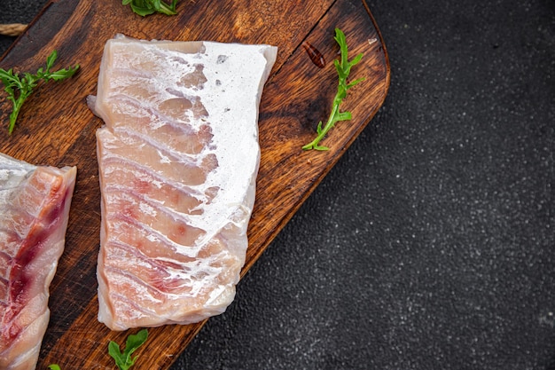 Foto filé de peixe branco bacalhau fresco peixe frutos do mar refeição comida lanche na mesa copiar espaço fundo de comida