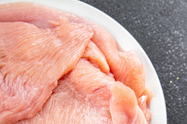 filete de carne de peru cru fatia de carne de aves frescas comer saudável cozinhar refeição comida lanche na mesa