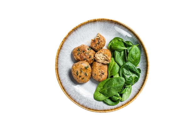 Fischfrikadellen oder Fischbällchen mit Thunfisch und Spinat in einem Teller isoliert auf weißem Hintergrund