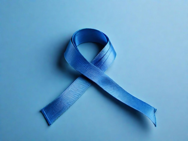 Foto fita azul de conscientização mundial sobre o câncer em fundo azul