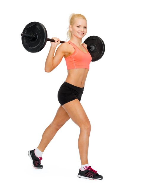 Fitness-, Sport- und Trainingskonzept - lächelnde sportliche Frau mit Langhantel beim Split-Squat oder Longe
