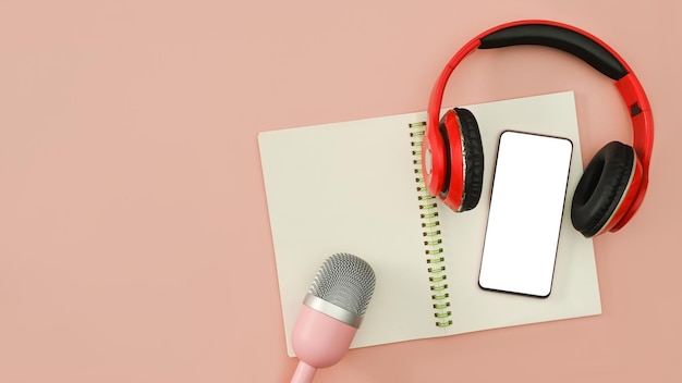 Foto flaches smartphone-kopfhörermikrofon und notebook auf rosa hintergrund. radio-podcasts, bloggen und technologiekonzept