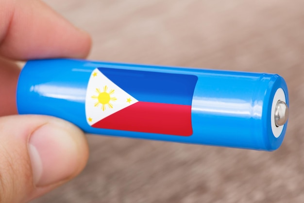 Flagge der Philippinen auf Löwenbatterie Konzept zur Herstellung von Batterien auf den Philippinen