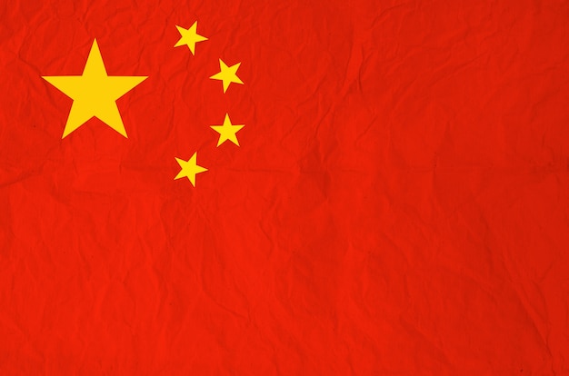 Flagge der Volksrepublik China mit altem Papier der Weinlese