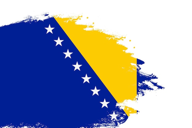 Flagge von Bosnien und Herzegowina auf einem fleckigen Pinselstrich, isoliert auf weißem Hintergrund mit Kopierraum