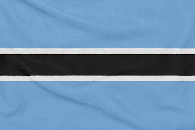 Flagge von Botswana auf strukturiertem Gewebe. Patriotisches Symbol