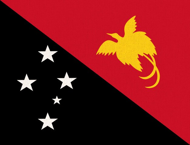 Foto flagge von papua-neuguinea flagge papua-neuginea auf stoffoberfläche