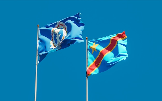 Flaggen der Nördlichen Marianen und der DR Kongo auf blauem Himmel. 3D-Grafik