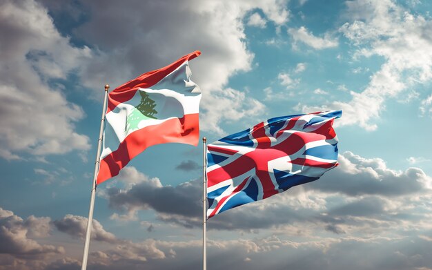 Flaggen des Libanon und der britischen Briten am blauen Himmel. 3D-Grafik