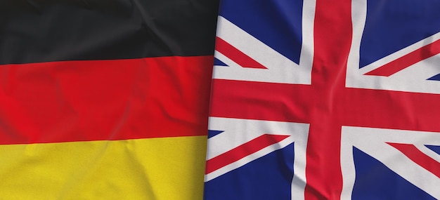 Flaggen von Deutschland und dem Vereinigten Königreich. Leinenflaggen in Großaufnahme. Flagge aus Leinwand. Deutsche Berlin-Großbritannien-Staatsnationalsymbole, 3D-Illustration