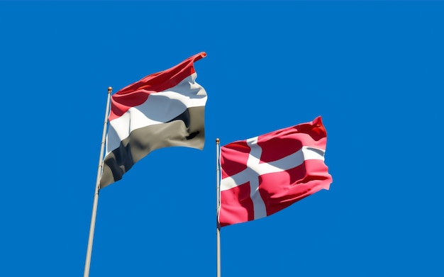Flaggen von Jemen und Dänemark. 3D-Grafik