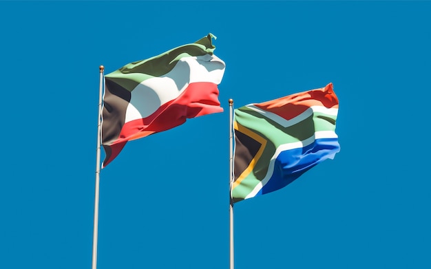 Flaggen von Kuwait und SAR African auf blauem Himmel. 3D-Grafik