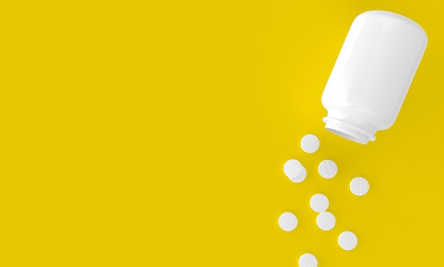 Flasche und Aspirinpillen oder Schmerzmittel auf gelbem Hintergrund, so dass links ein zusätzlicher Platz bleibt