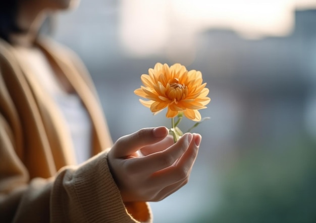 Flor amarela na mão no fundo escuro ai generated