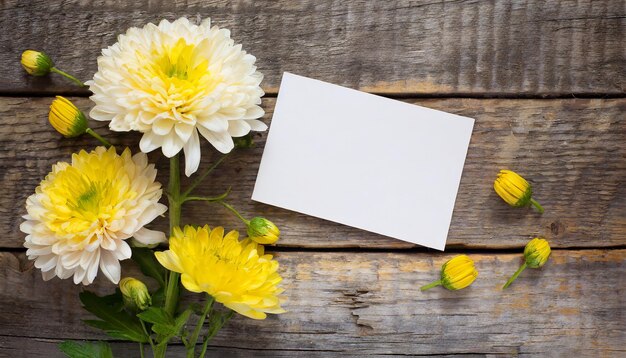 Foto flor de crisantemo con tarjeta en blanco sobre un fondo de madera envejecido