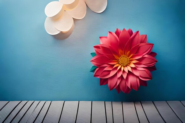 Una flor rosada sobre un fondo azul con una lámpara blanca y una lámpada blanca.