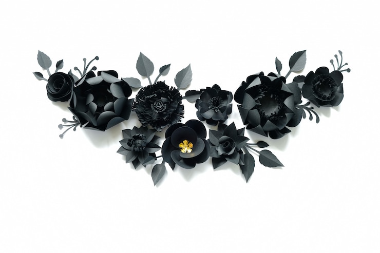 Foto flores de papel preto no branco. corte do papel.