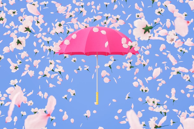 Flores macias caindo no guarda-chuva rosa contra um fundo azul